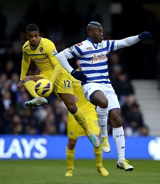 Intense Rivalry: McCleary vs. Cisse in the Barclays Premier League Clash between QPR and Reading