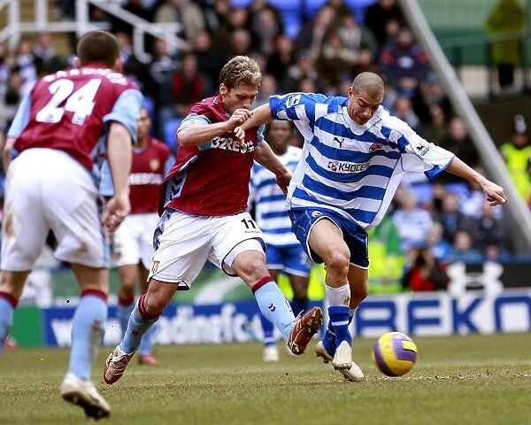 James Harper takes on Aston Villas Stiliyan Petrov in the 2-0 home win