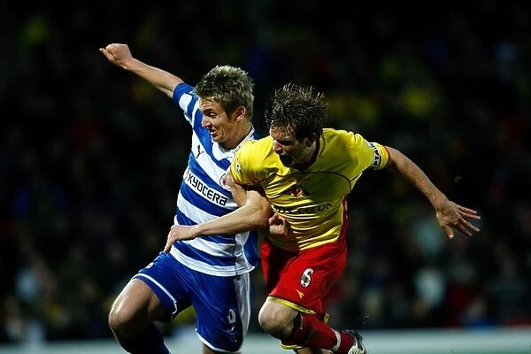 Kevin Doyle and Jay DeMerit battle for the ball