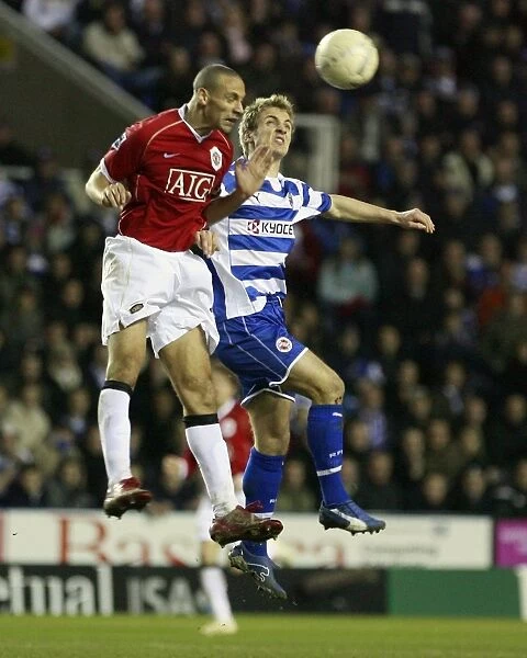 Kevin Doyle and Rio Ferdiand leap for the ball in the narrow 3-2 FA Cup defeat at the Madejski
