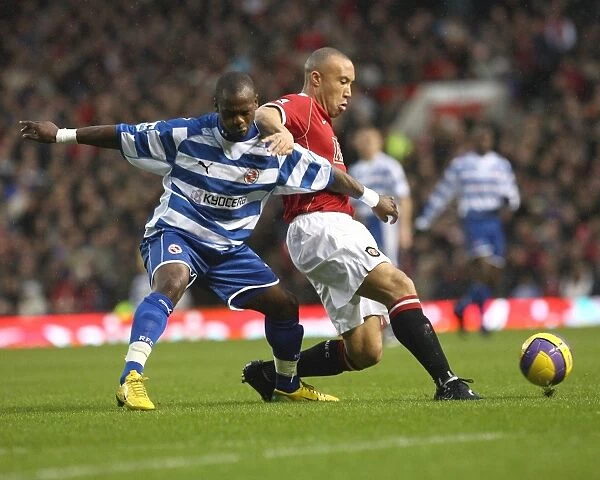 Leroy Lita battles with Michael Silvestre in the 3-2 defeat at Old Trafford