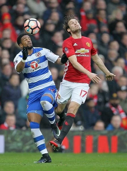 Manchester United vs Reading - Emirates FA Cup Third Round: Intense Battle Between Daley Blind and Garath McCleary for Ball Control