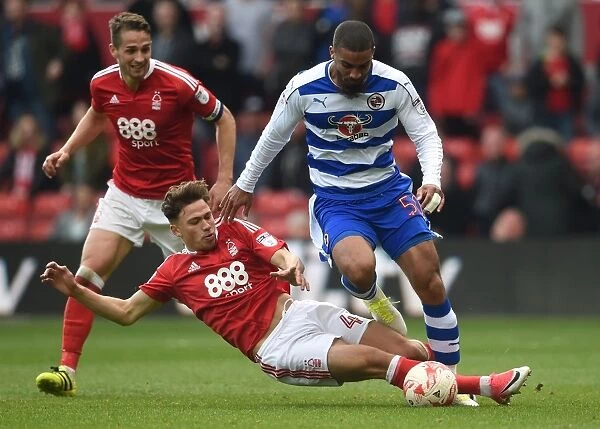 Matty Cash vs. Lewis Grabban: Intense Tackle in Nottingham Forest vs. Reading Championship Clash at City Ground