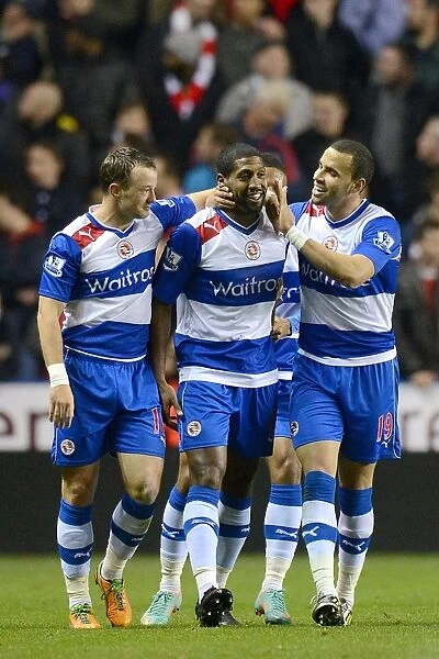 Reading's Historic Night: Noel Hunt, Mikele Leigertwood, and Hal Robson-Kanu's Triumphant Celebration of the Third Goal Against Arsenal in the Capital One Cup