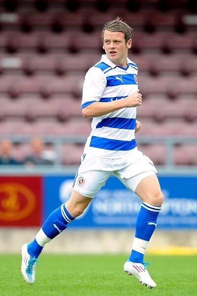Reading's Jake Taylor in Action: Pre-Season Clash Against Northampton Town