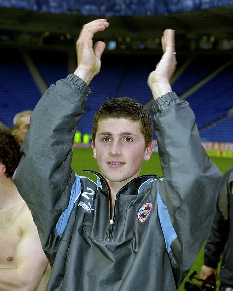 Shane Long applauds the Reading Fans celebrating promotion to the Premiership