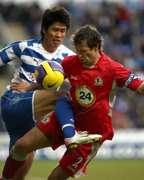 Soel Ki-Hyeon tackles Blackburns Captain Lucas Neill