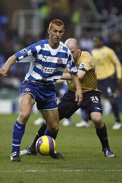 Steve Sidwell receives a shove from Evertons Lee Carsley