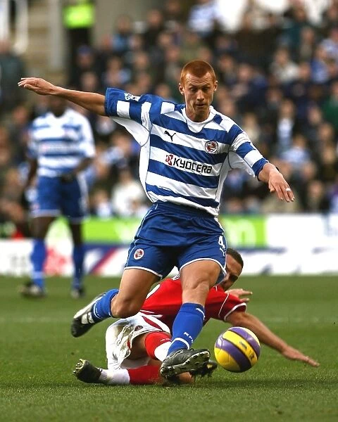 Steve Sidwell rides a challenge from Luke Young