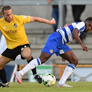 Battle for the Ball: A Riveting Moment between Stuart Sinclair and Tarique Fosu in the Pre-Season Friendly between Bristol Rovers and Reading