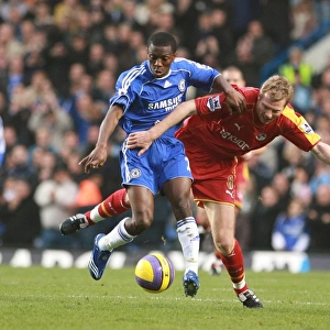 Brynjar Gunnarsson and Shaun Wright-Phillips struggle for the ball