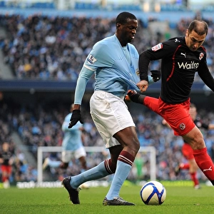 FA Cup Showdown: Yaya Toure vs. Zurab Khizanishvili - A Battle for Manchester City's Ball