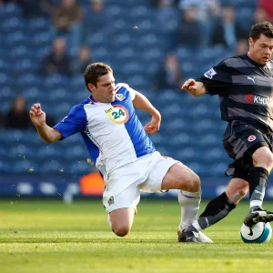 Graeme Murty avoids a challenge from David Dunn