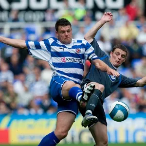 Graeme Murty and Jason Koumas challenge for the ball