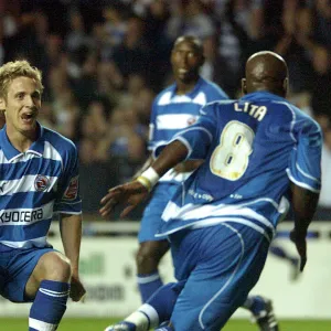 Kevin Doyle runs to meet Leroy Lita