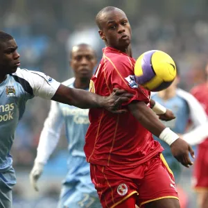 Leroy Lita challenged by Manchester Citys Micah Richards