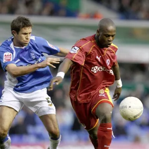 Leroy Lita prepares to shoot under a challenge from Matthew Upson