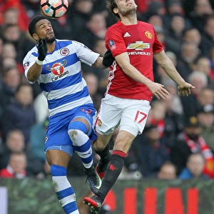 Manchester United vs Reading - Emirates FA Cup Third Round: Intense Battle Between Daley Blind and Garath McCleary for Ball Control