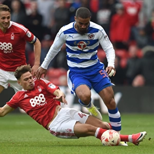 Matty Cash vs. Lewis Grabban: Intense Tackle in Nottingham Forest vs. Reading Championship Clash at City Ground