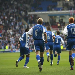 Reading players returning to their half after leveling the score against Liverpool