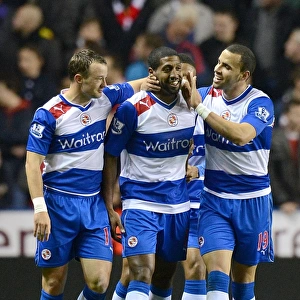 Reading's Historic Night: Noel Hunt, Mikele Leigertwood, and Hal Robson-Kanu's Triumphant Celebration of the Third Goal Against Arsenal in the Capital One Cup