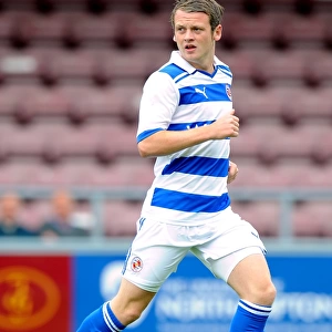 Reading's Jake Taylor in Action: Pre-Season Clash Against Northampton Town