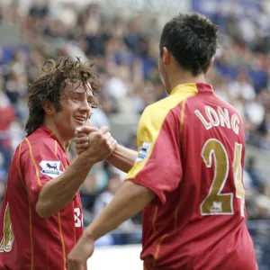 Shane Long goes to congratulate Stephen Hunt on scoring his 92nd minute goal at the Reebok Stadium