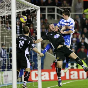 Shane Long rises above Wigans David Unsworth to score his 51st minute goal