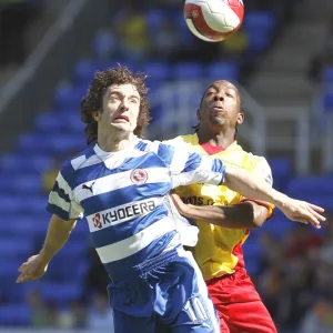 Stephen Hunt gets a shove from Watfords Lloyd Doyley