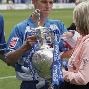 Steve Sidwell shows his wife the trophy