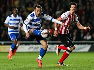 Images Dated 13th April 2012: Adam Le Fondre Outmaneuvers Alex Pearce: A Championship Battle at St. Mary's