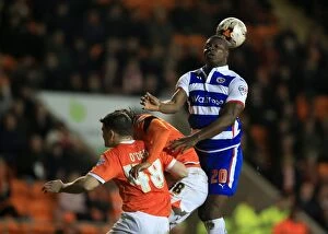 Images Dated 7th April 2015: Aiyegbeni Yakubu Heads the Ball for Reading in Sky Bet Championship Match