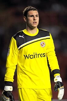 Images Dated 23rd August 2011: Alex McCarthy's Determined Performance: Reading FC Advances Past Charlton Athletic in Carling Cup