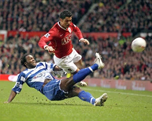 Images Dated 18th February 2007: Andre Bikey tackles Cristiano Ronaldo at Old Trafford in the FA Cup 5th Round