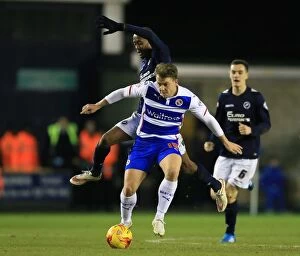 Millwall v Reading Collection: Battle for the Ball: Abdou vs. Cox in Millwall vs. Reading Championship Clash