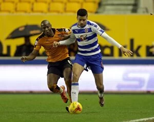 Images Dated 26th December 2015: Battle for the Ball: Afobe vs. Hector - Wolves vs. Reading's Intense Championship Clash