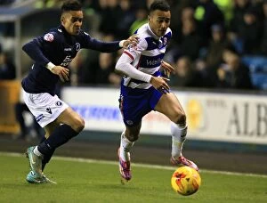Images Dated 27th January 2015: Battle for the Ball: Cowan-Hall vs. Obita - Millwall vs. Reading Championship Clash