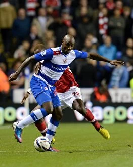 Capital One Cup : Round 4 : Reading v Arsenal : Madejski Stadium : 30-10-2012 Collection: Battle for the Ball: Djourou vs. Roberts in the Intense Capital One Cup Clash between Reading