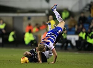 Images Dated 27th January 2015: Battle for the Ball: Dunne vs. Pogrebnyak - Millwall vs. Reading Championship Clash