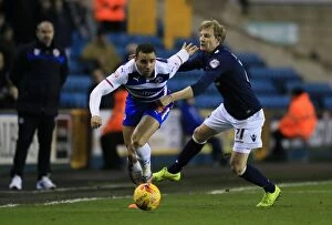 Images Dated 27th January 2015: Battle for the Ball: Harding vs. Robson-Kanu in Millwall vs. Reading Championship Clash