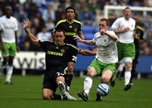 Images Dated 1st August 2009: Battle for the Ball: John Terry vs. Scott Davies in Reading FC's Pre-Season Clash with Chelsea
