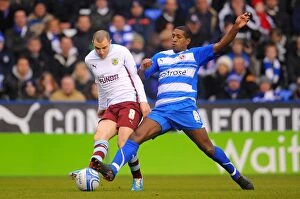 Images Dated 5th January 2011: Battle for the Ball: Leigertwood vs Marney in Reading vs Burnley Championship Showdown