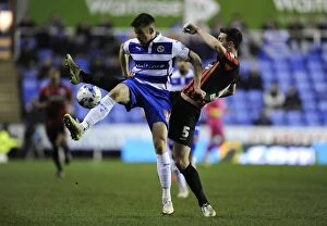 Reading v Brighton & Hove Albion Collection: Battle for the Ball: Mackie vs. Dunk in Reading's Championship Showdown Against Brighton