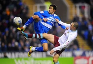 Images Dated 5th January 2011: Battle for the Ball: Marney vs. Karacan - Npower Championship Showdown between Reading and Burnley