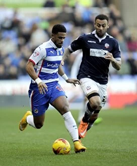 Images Dated 6th December 2014: Battle for the Ball: McCleary vs. Davies in the Intense Sky Bet Championship Clash at Madejski