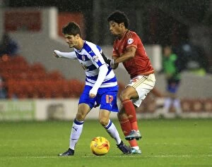 Images Dated 28th November 2015: Battle for the Ball: Mendes De Graca vs. Piazon - Championship Clash between Nottingham Forest