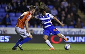 Images Dated 22nd April 2015: Battle for the Ball: Nathan Ake vs. Michael Morrison in the Sky Bet Championship Clash at Madejski
