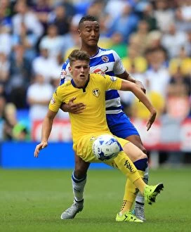 Images Dated 16th August 2015: Battle for the Ball: Obita vs. Byram in the Intense Sky Bet Championship Clash between Reading