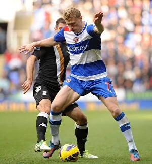 Images Dated 27th October 2012: Battle for the Ball: Pogrebnyak vs. Hughes - Reading vs. Fulham, Premier League Rivalry