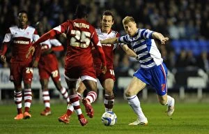 Images Dated 22nd April 2014: Battle for the Ball: Pogrebnyak vs. Whitehead in the Intense Sky Bet Championship Clash - Reading